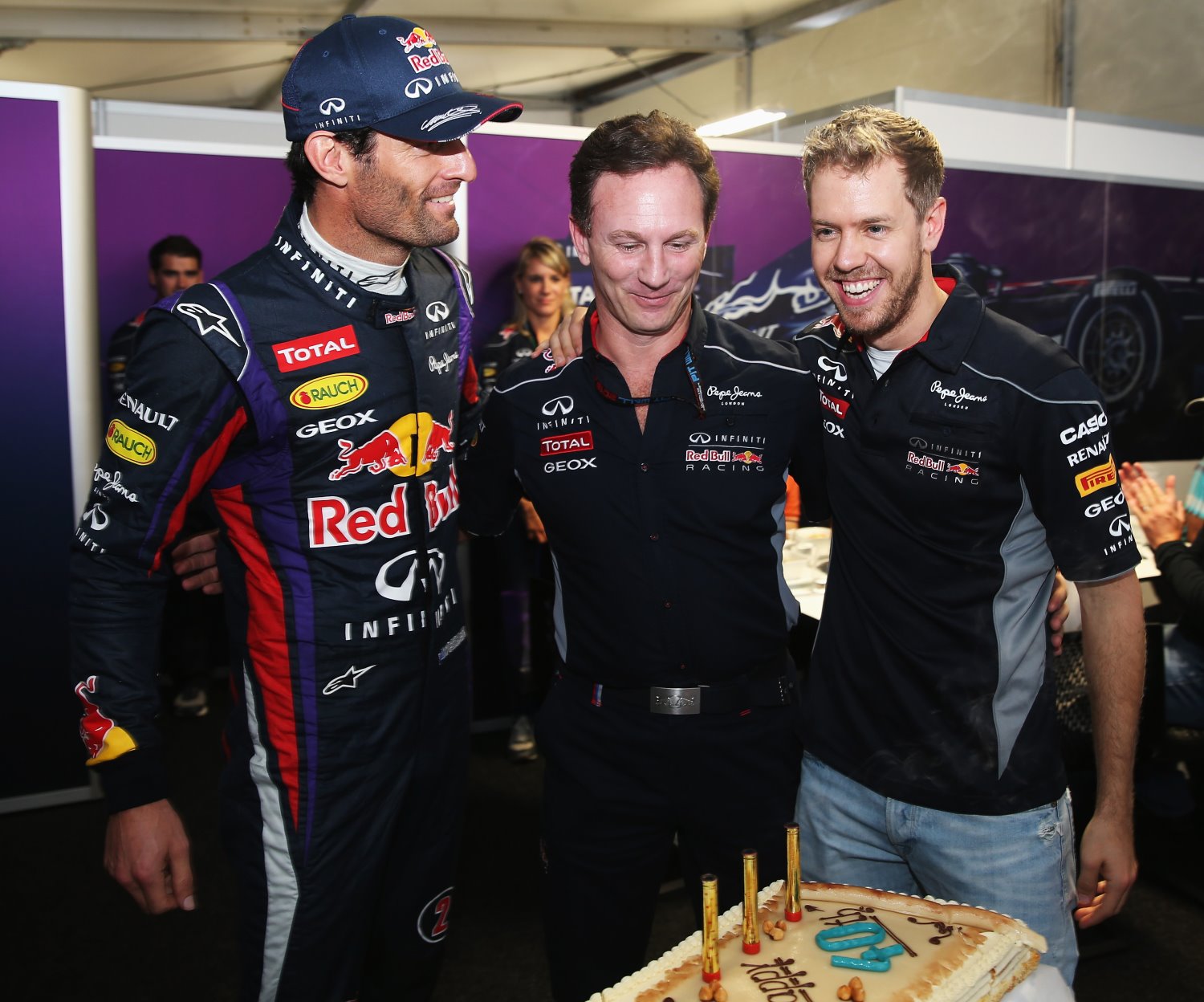 FORMULA 1 - Grand Prix of USA, Circuit of The Americas. Image shows Mark Webber (AUS) and Sebastian Vettel (GER/ Red Bull Racing) bring out a cake for their Team Principal Christian Horner as he celebrates his 40th birthday. Photo: Getty Images/ Mark Thompson - For editorial use only. Image is free of charge