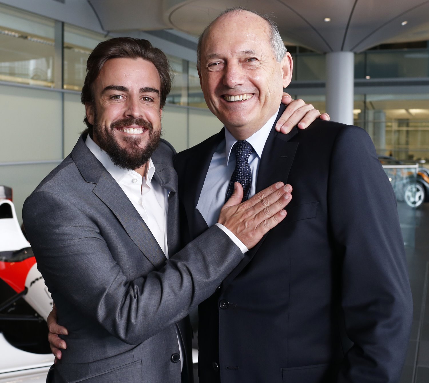 Dennis (R) says Alonso and Button are happy with the McLaren