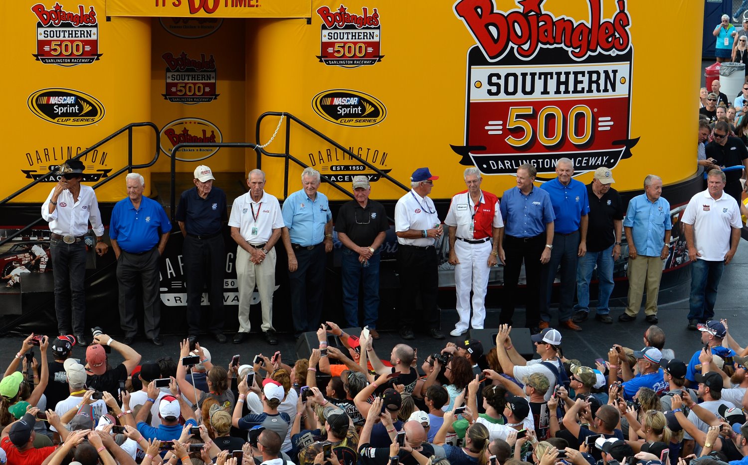 DARLINGTON, SC - SEPTEMBER 06: NASCAR Hall of Famers (L-R) Richard Petty, Junior Johnson, Bud Moore, Ned Jarrett, Bobby Allison, Cale Yarborough, Dale Inman, Leonard Wood, Rusty Wallace, Dale Jarrett, Jack Ingram, Rex White and Terry Labonte are honored during pre-race ceremonies forthe NASCAR Sprint Cup Series Bojangles' Southern 500 at Darlington Raceway on September 6, 2015 in Darlington, South Carolina. (Photo by Robert Laberge/NASCAR via Getty Images)