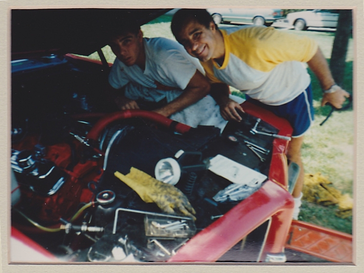 Keith and his father, Philip (yellow shirt) re-assembling the engine of his first Pontiac LeMans, New Jersey, fall 1985 