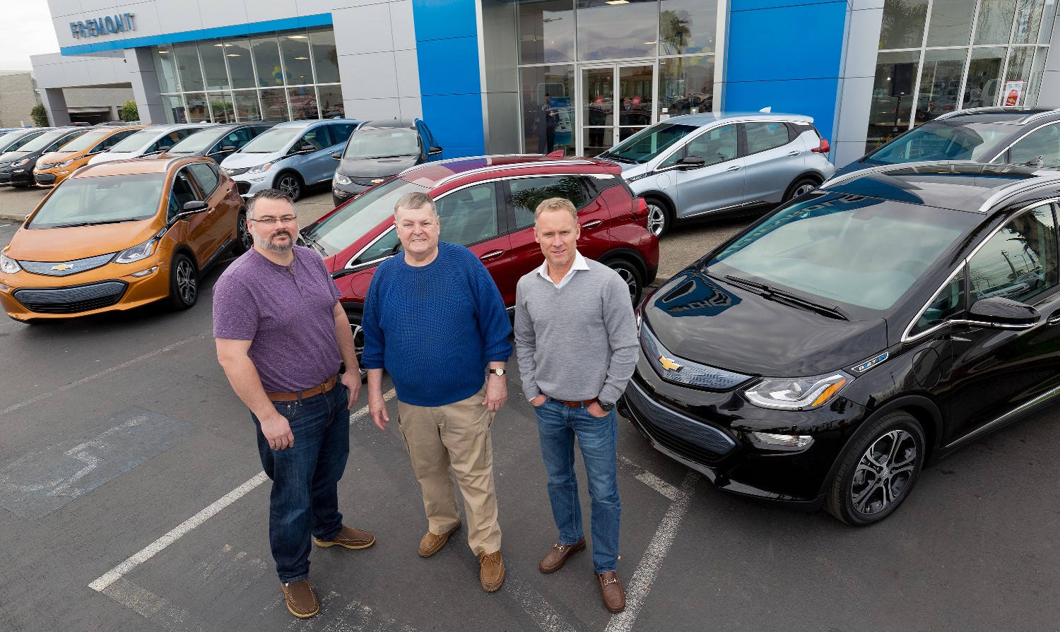 Customers Bobby Edmonds (l to r) of Castro Valley, CA, William 'Bill' Mattos of Fremont, CA, and Steve Henry of Portola Valley, CA take delivery of the first three 2017 Chevrolet Bolt EVs Tuesday, December 13, 2016 at Fremont Chevrolet in Fremont, CA. The all-electric Bolt EV offers an EPA-estimated 238 miles of range on a full charge.