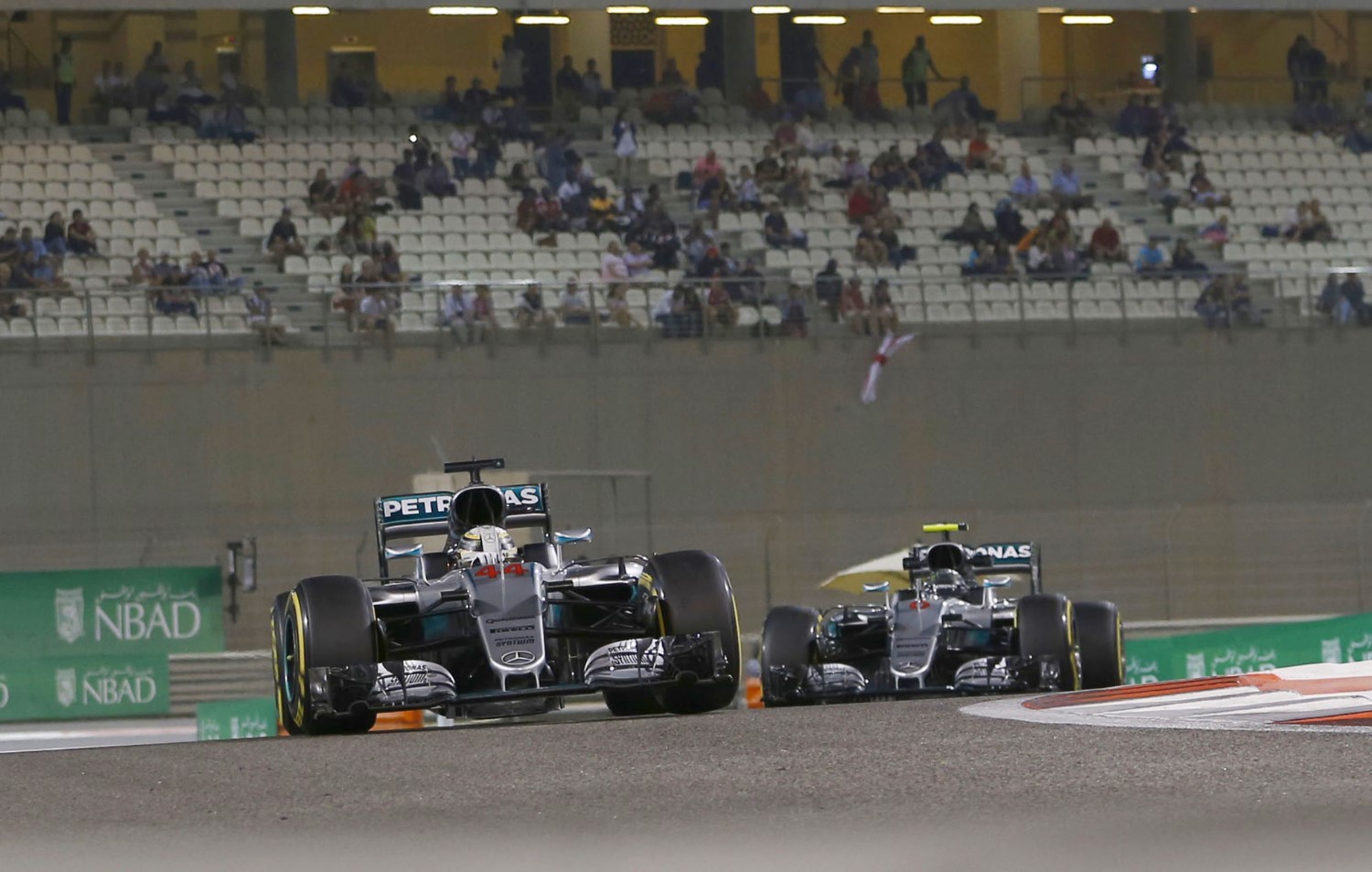 Hamilton and Rosberg practicing how to parade around Abu Dhabi