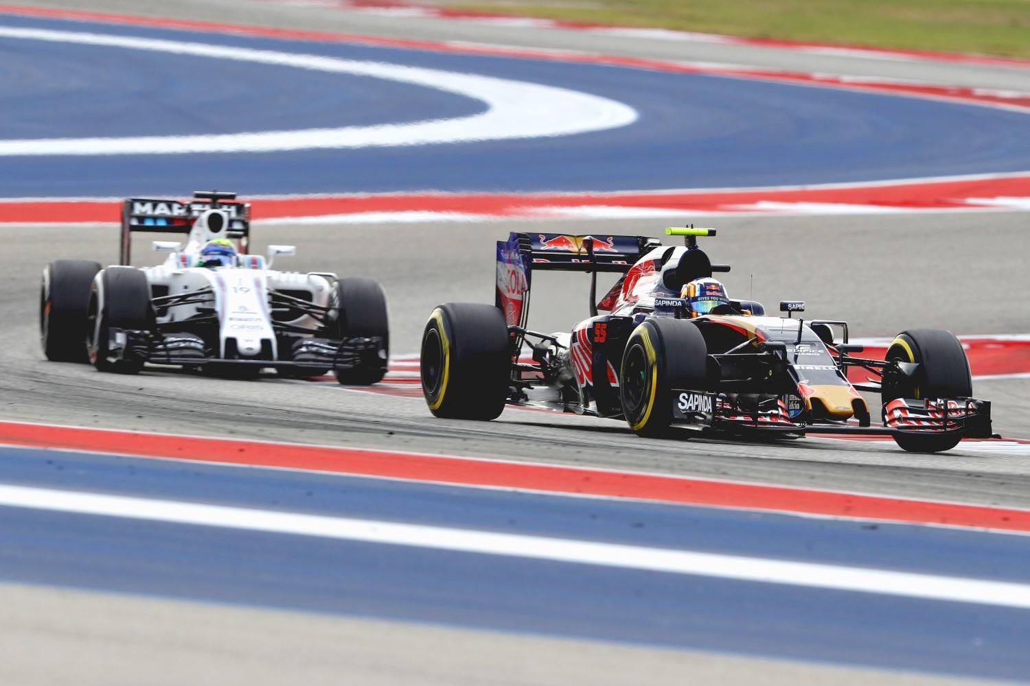 Felipe Massa chasing Carlos Sainz Jr. in Austin