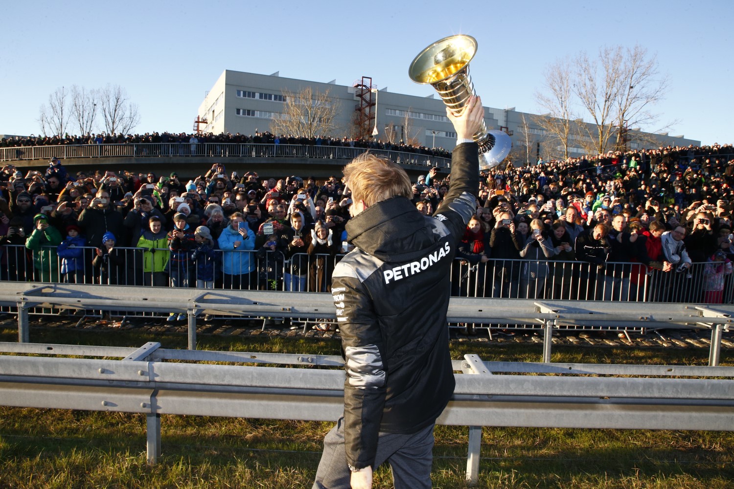 Rosberg waves to the factory workers