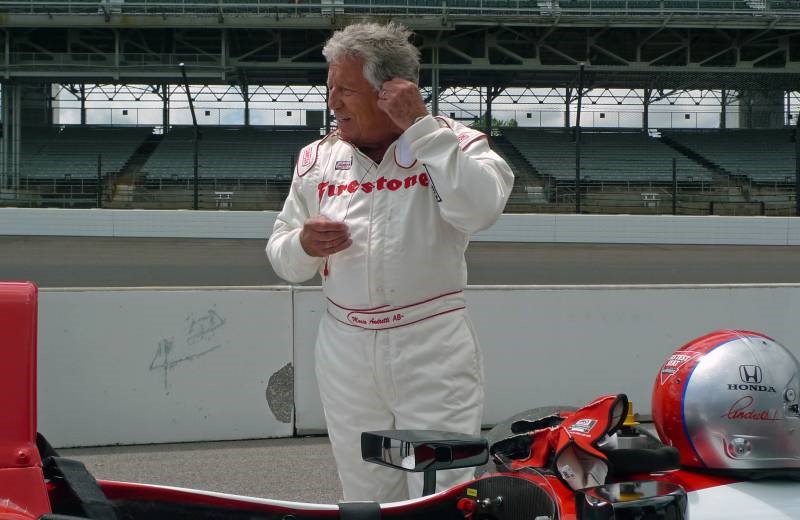 Mario Andretti gets ready to drive the 2-seat IndyCar at Indy