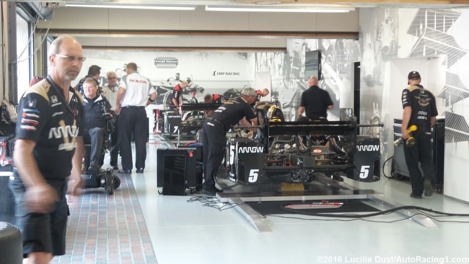 Sam Schmidt (in wheelchair) has his Indy Garage all pimped out