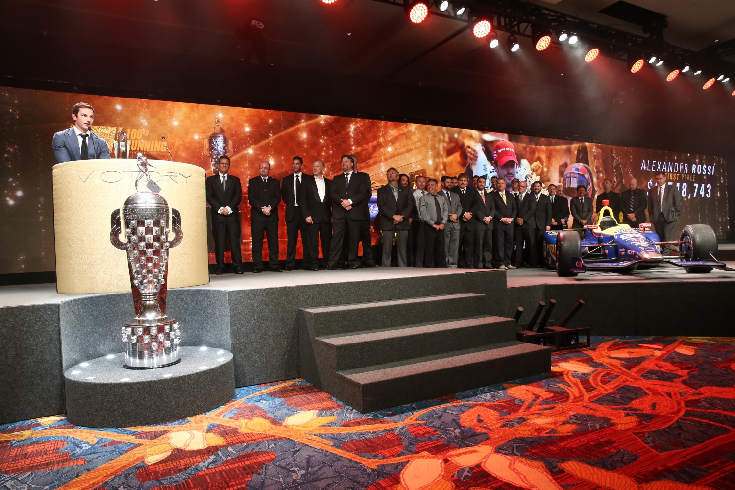 Rossi was joined on stage by his winning car and team.Rossi was joined on stage by his winning car and team