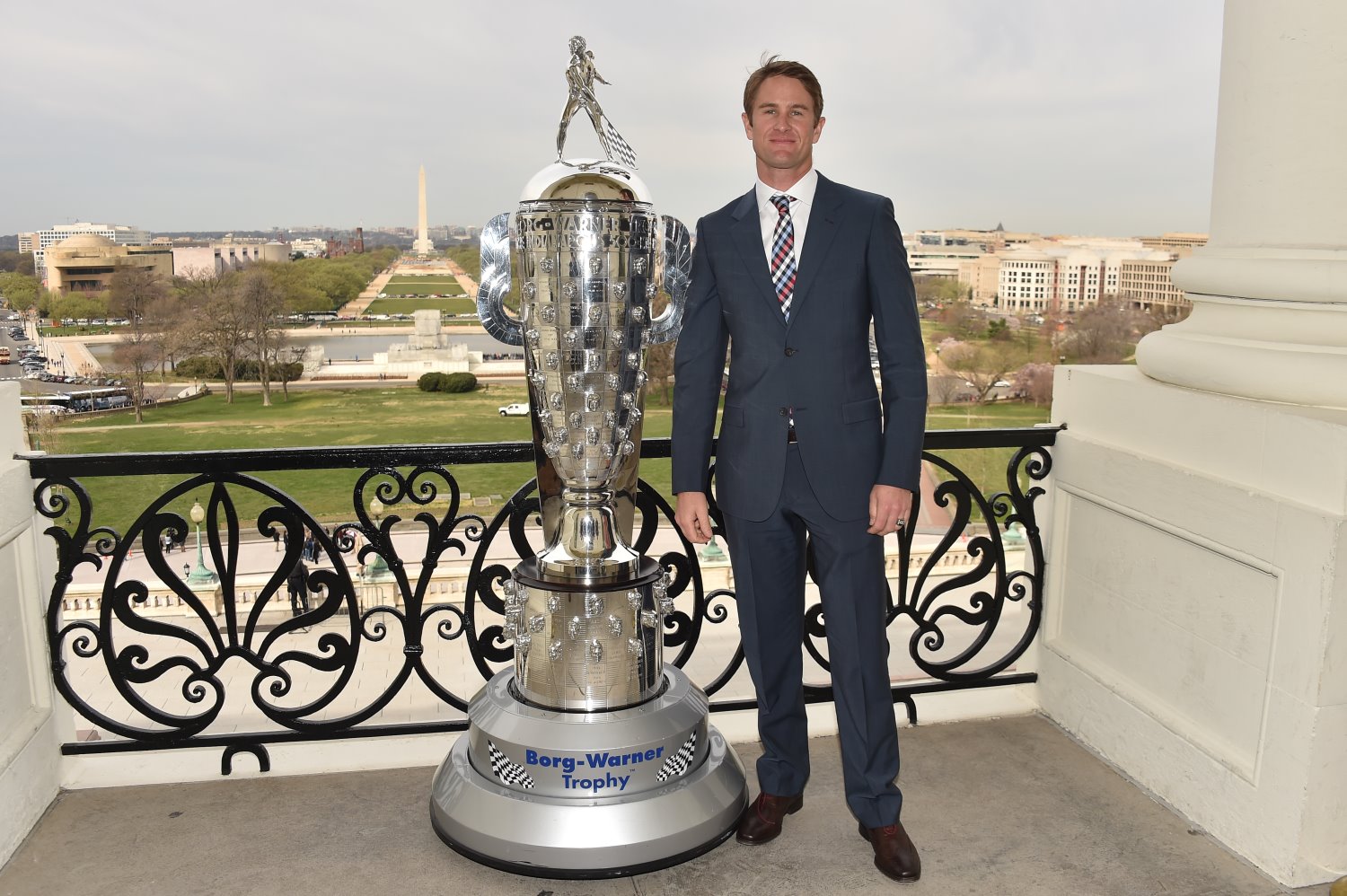 Hunter-Reay with the Borg Warner Trophy overlooking the Washington Monument