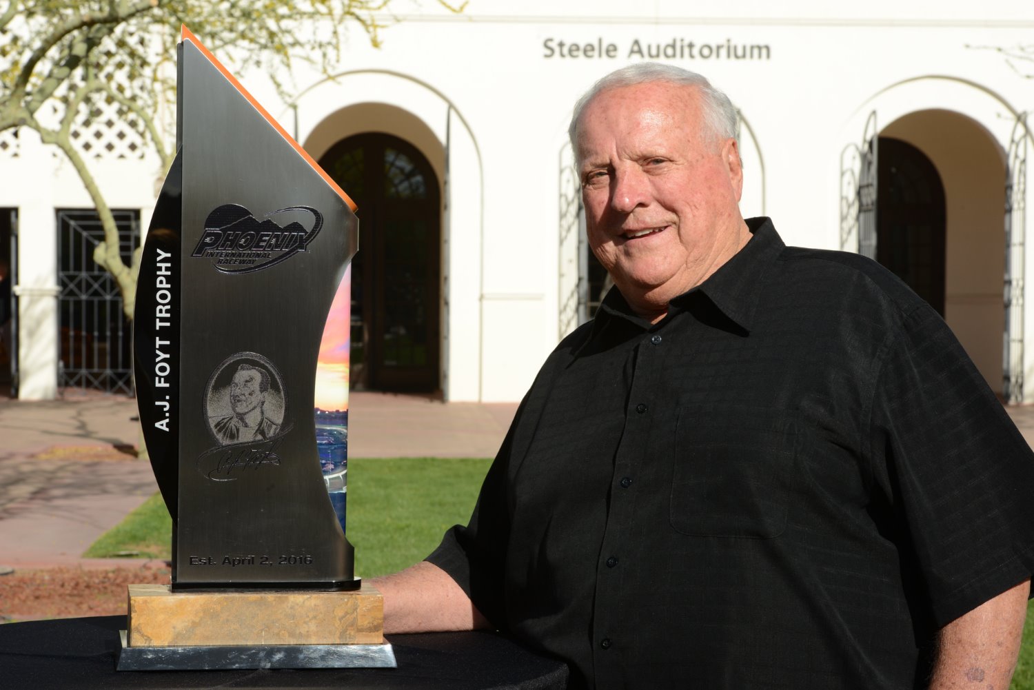 A.J. Foyt poses with the A.J Foyt Champions trophy in front of the Heard Museum in downtown Phoenix