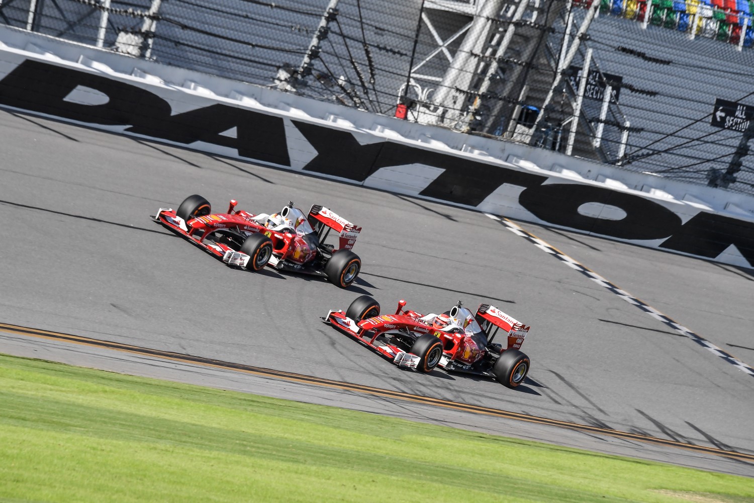 Raikkonen and Vettel race a pair of Ferrari F60s around Daytona