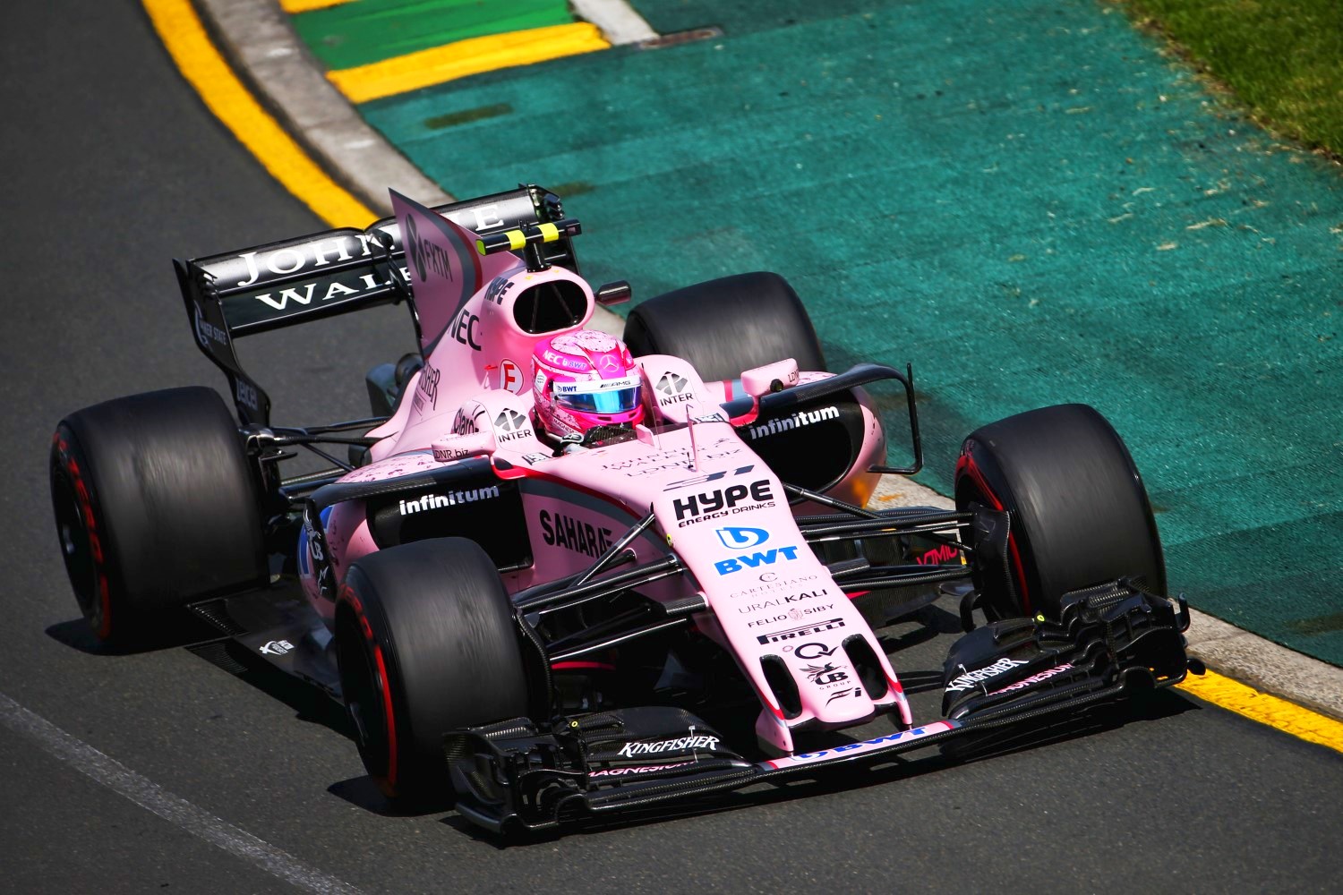 Esteban Ocon in his pretty pink car and his pretty pink helmet