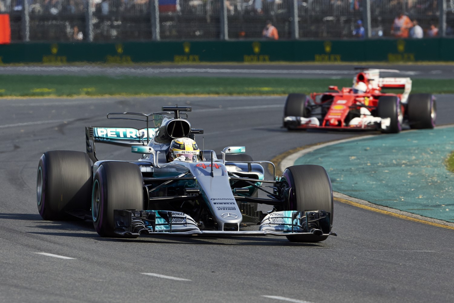 Eventual winner Sebastian Vettel hounds Lewis Hamilton in last year's race