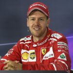 Vettel talks to the assembled media after the race