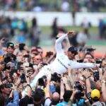 Hamilton body surfs his fans