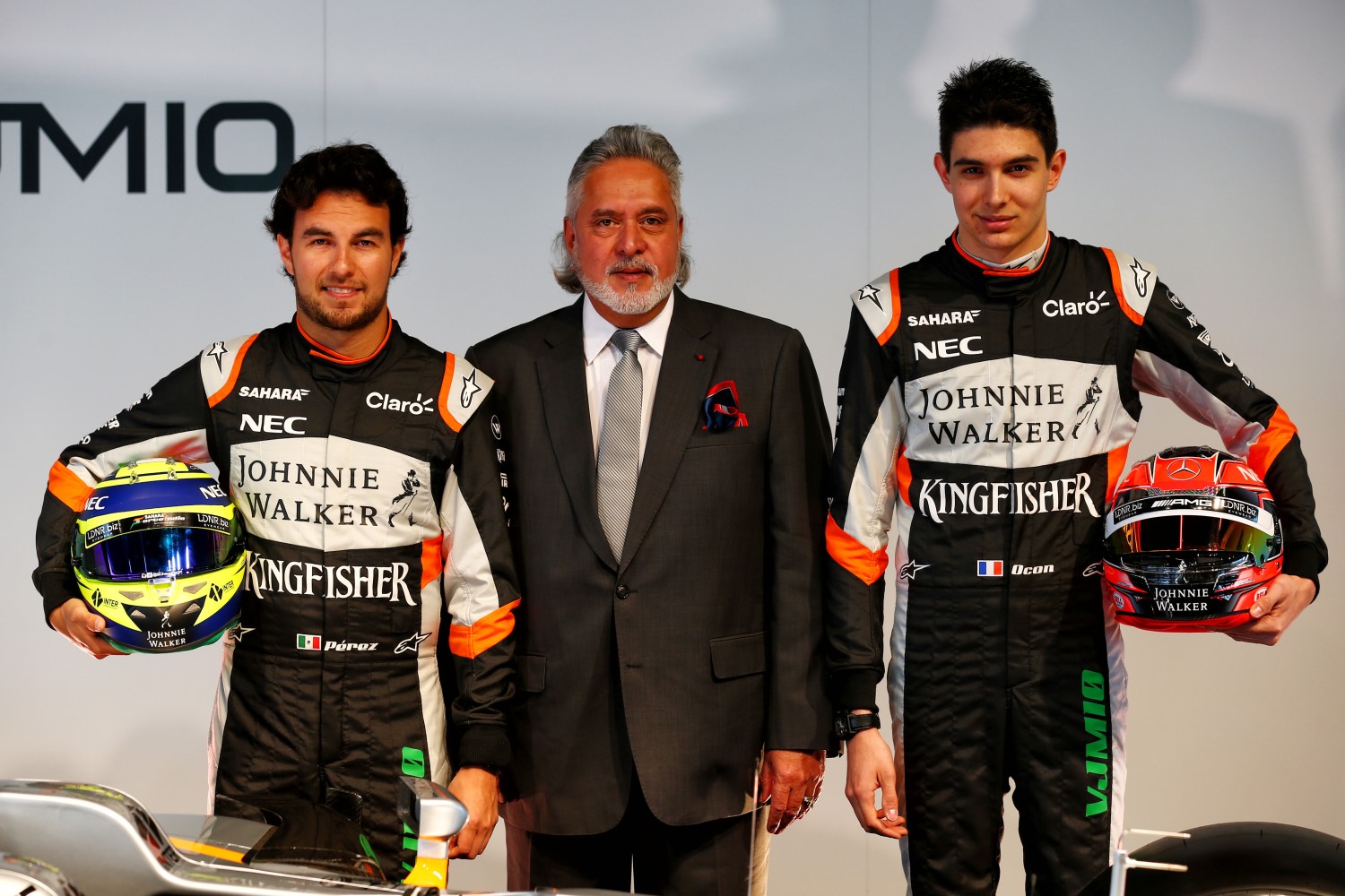 Mallya (C) likes the money the gets from Carlos Slim to run Perez (L) and the engine discount he gets from Mercedes to run Ocon (R)