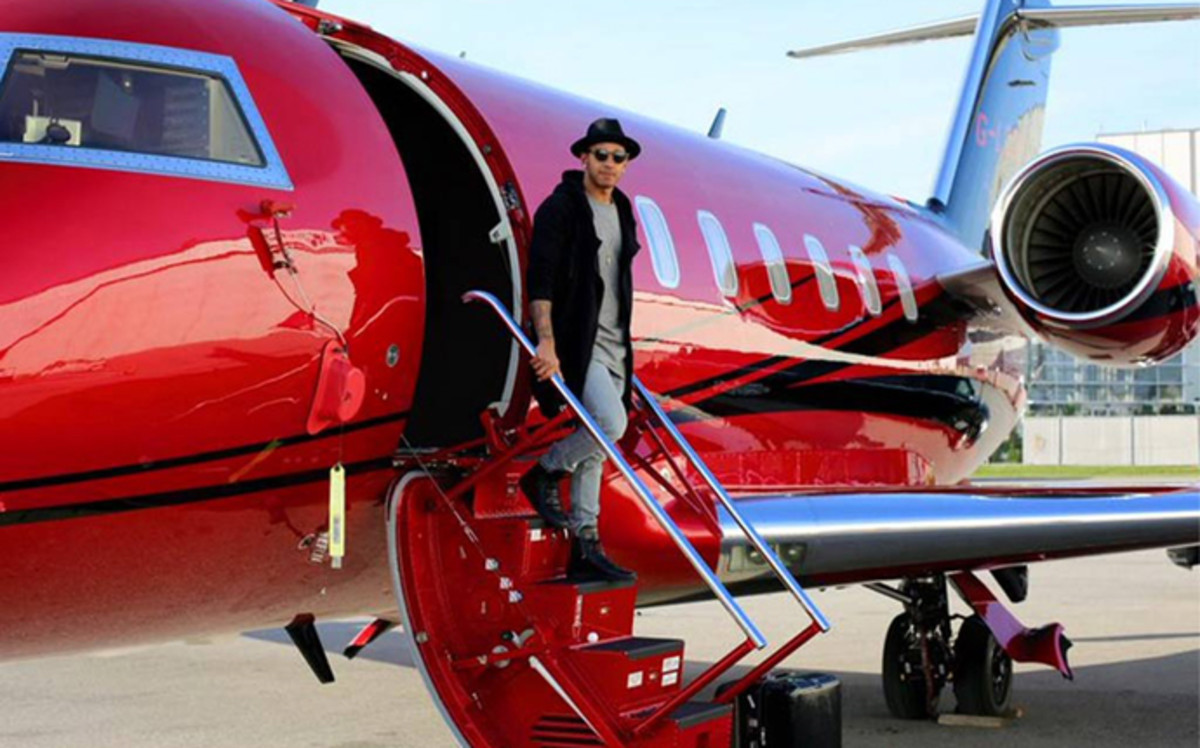 Lewis Hamilton leaving his jet he is accused of evading taxes on
