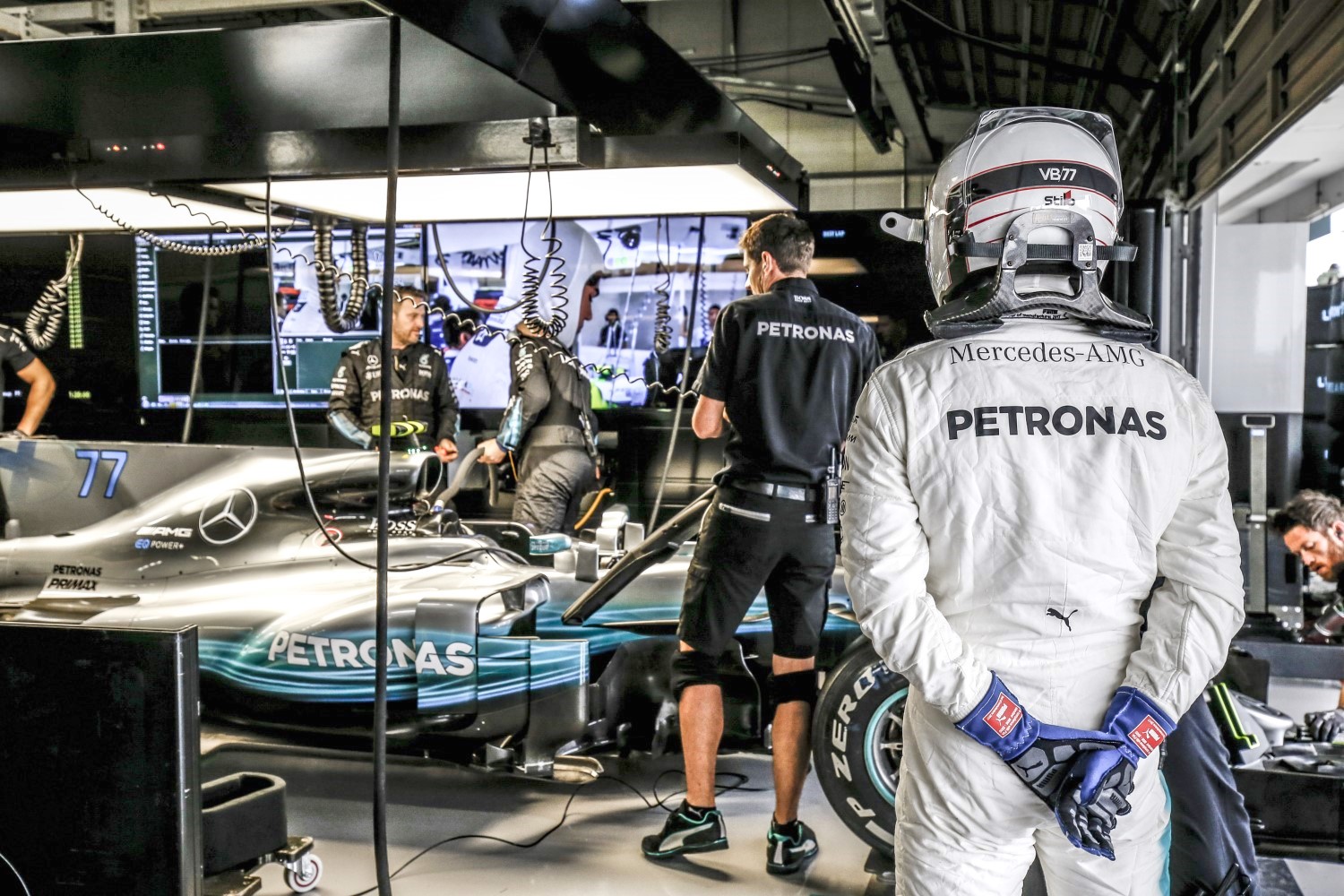 Valtteri Bottas watches team fix his damaged car