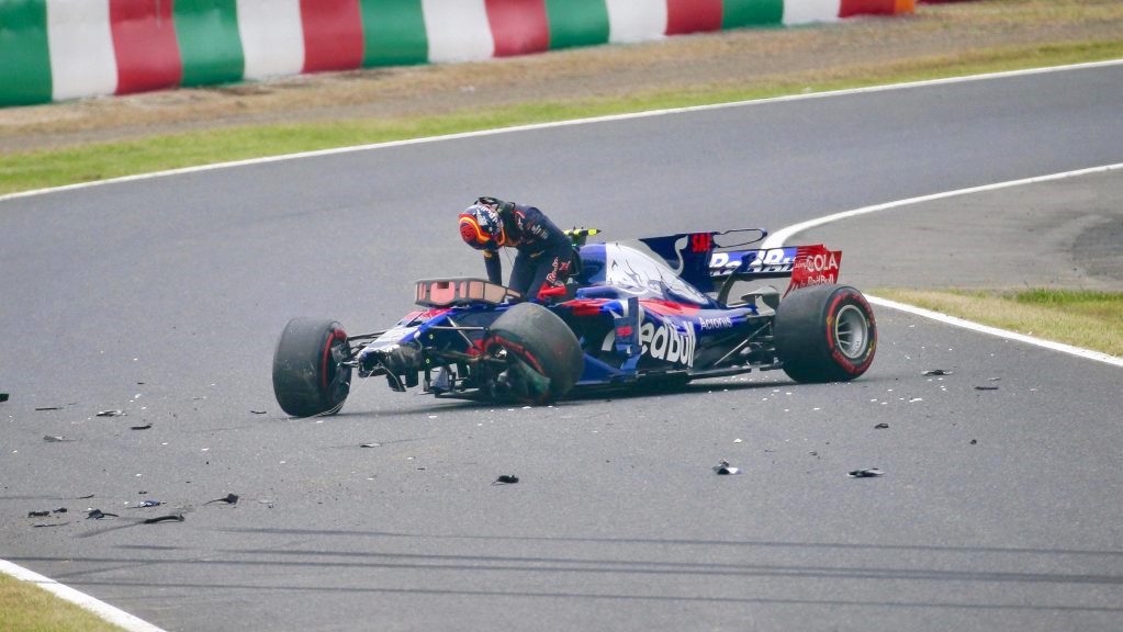 Sainz Jr climbs from his wrecked car