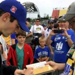 Rossi signs autograph for NASCAR fans