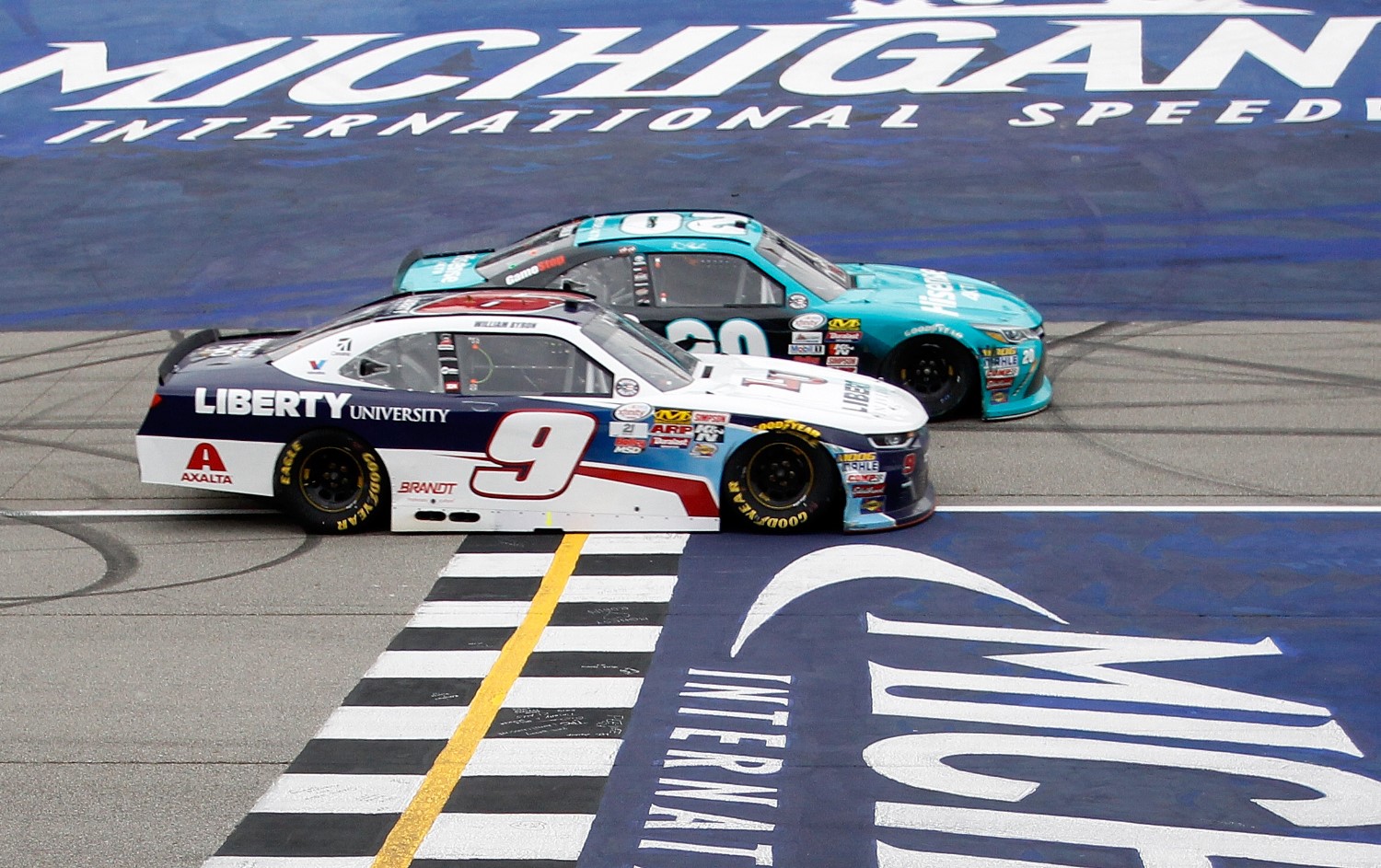 Denny Hamlin edges William Byron to the line to win the Irish Hills 250 by 0.012 second, the closest NASCAR XFINITY Series win at Michigan International Speedway