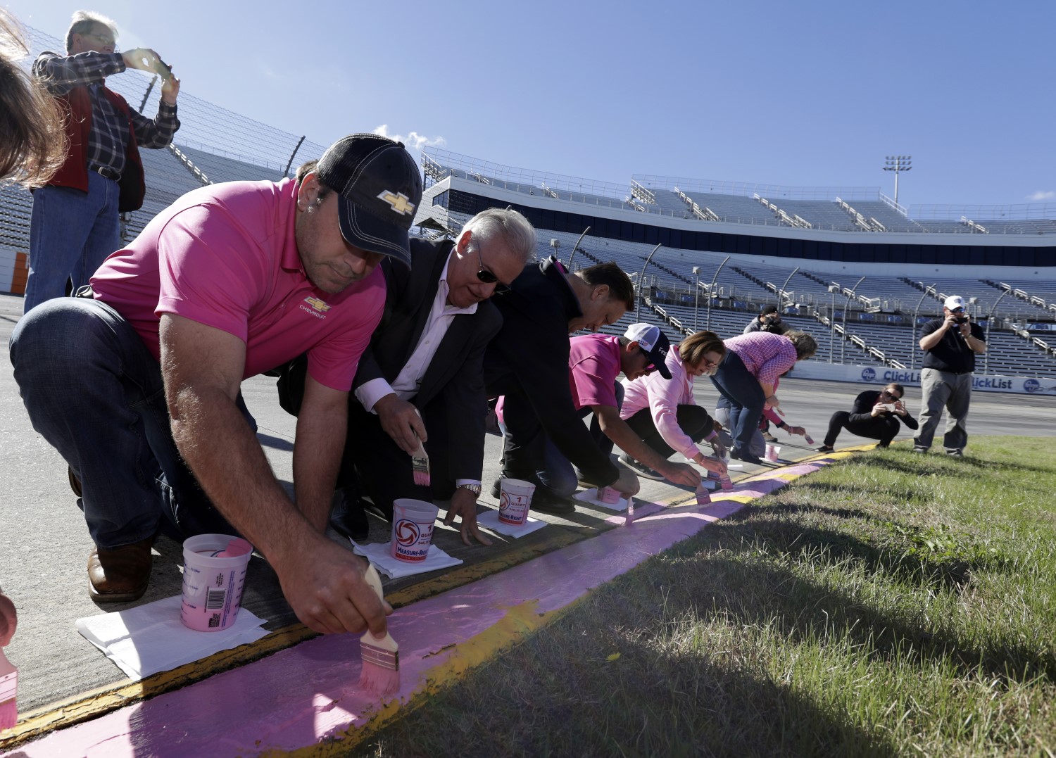 Newman and Larson paint the curbs pink