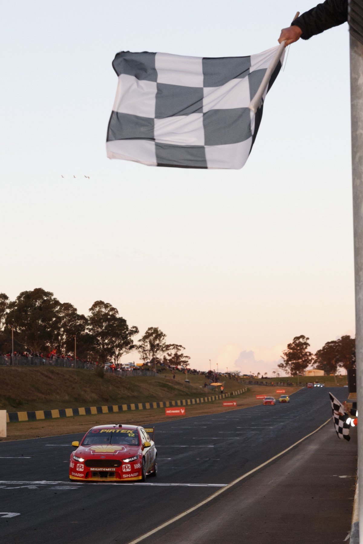 Coulthard takes the flag