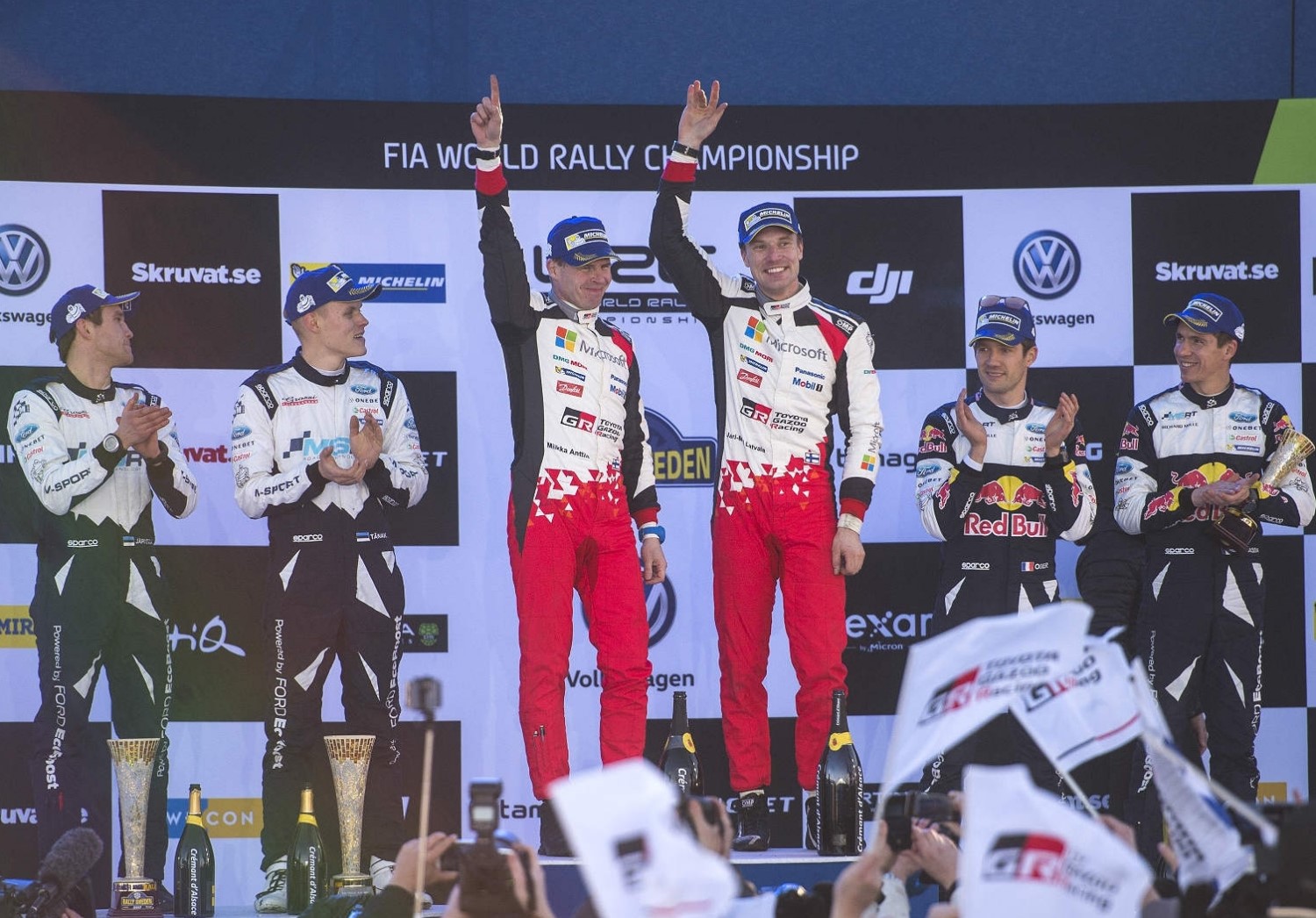 A happy Latvala (c) celebrates on the podium