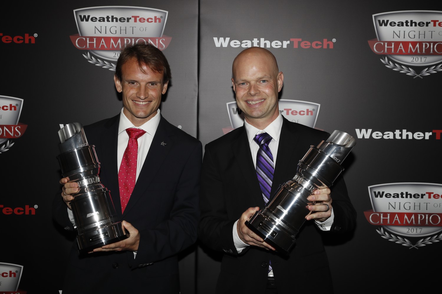 Corvette drivers Antonio Garcia and Jan Magnussen accept the 1st-place GTLM trophies