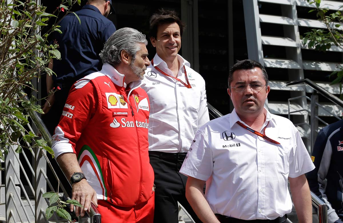 Arrivabene (L) leaves the Liberty meeting with Toto Wolff and Eric Boullier