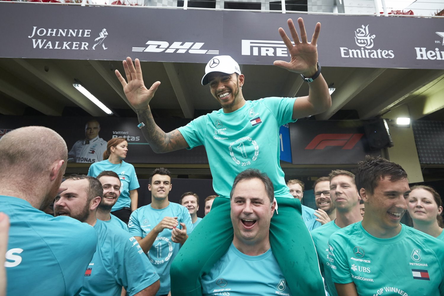 Hamilton celebrates with team