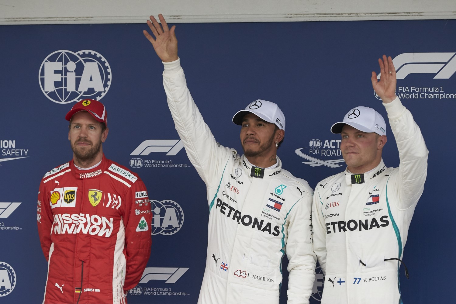 Hamilton and Bottas wave while Vettel waits to be disqualified