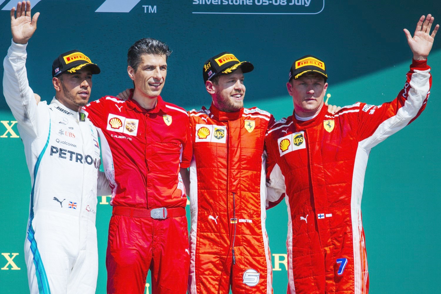 Hamilton left and Vettel (C) at Silverstone