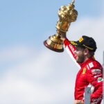 Vettel raises the winner's trophy