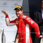 A happy Vettel on podium does Egyptian Walk