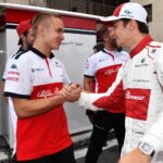 An elated Sauber crew greets Leclerc after qualifying