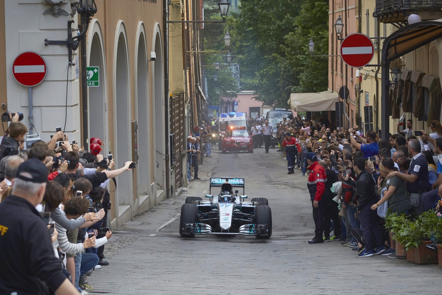 Bottas drives his Mercedes on the roads from Faenza to Bandini's home town of Brisighella