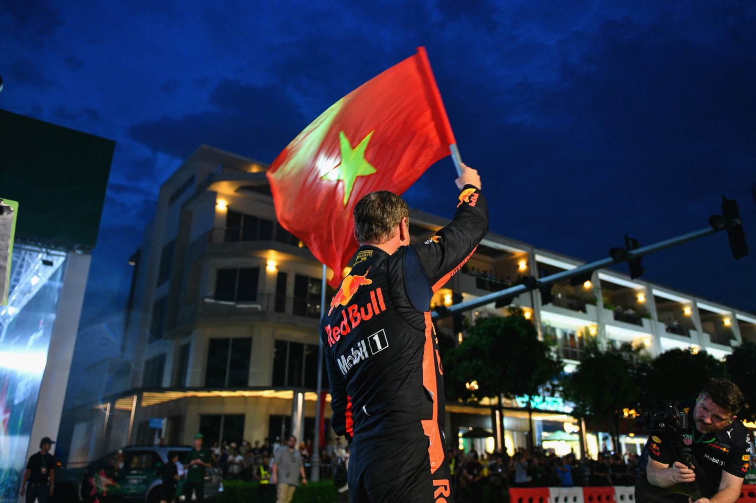 David Coulthard waves the Vietnam flag
