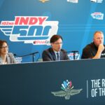 Allison Melangton, Doug Boles, and Jay Frye on stage during a press conference at the Indianapolis Motor Speedway