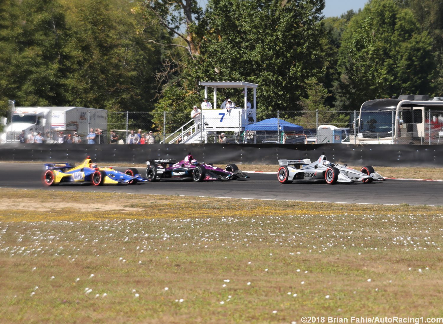 Newgarden and Rossi work thru traffic. Both drivers were screwed by the untimely yellow