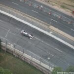 Newgarden speeds by a largely deserted race track