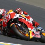 Marquez scraps the asphalt as he charges to victory