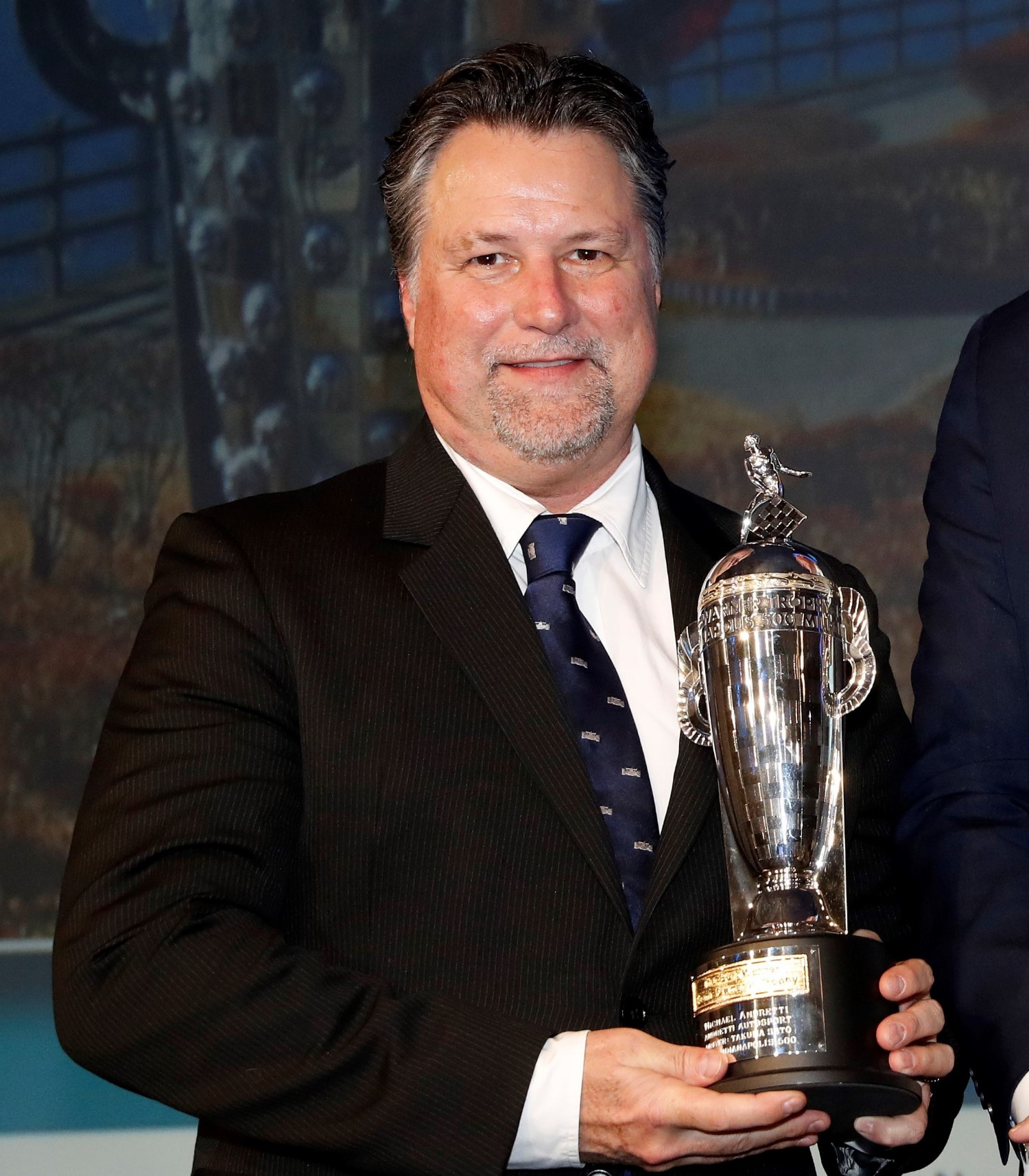 Michael Andretti collects his 5th Baby Borg - so small a Saturday Night track race trophy dwarfs it. IMS should be ashamed of themselves