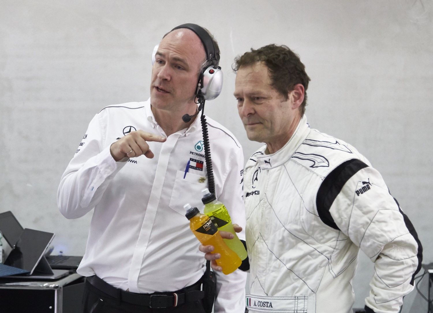 Aldo Costa (R) is why the Mercedes is fast. Shown here during a recent test run he made in one of his creations, Costa designs the best F1 cars for Mercedes