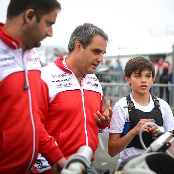 Montoya with his son Sebastian at a go-kart race