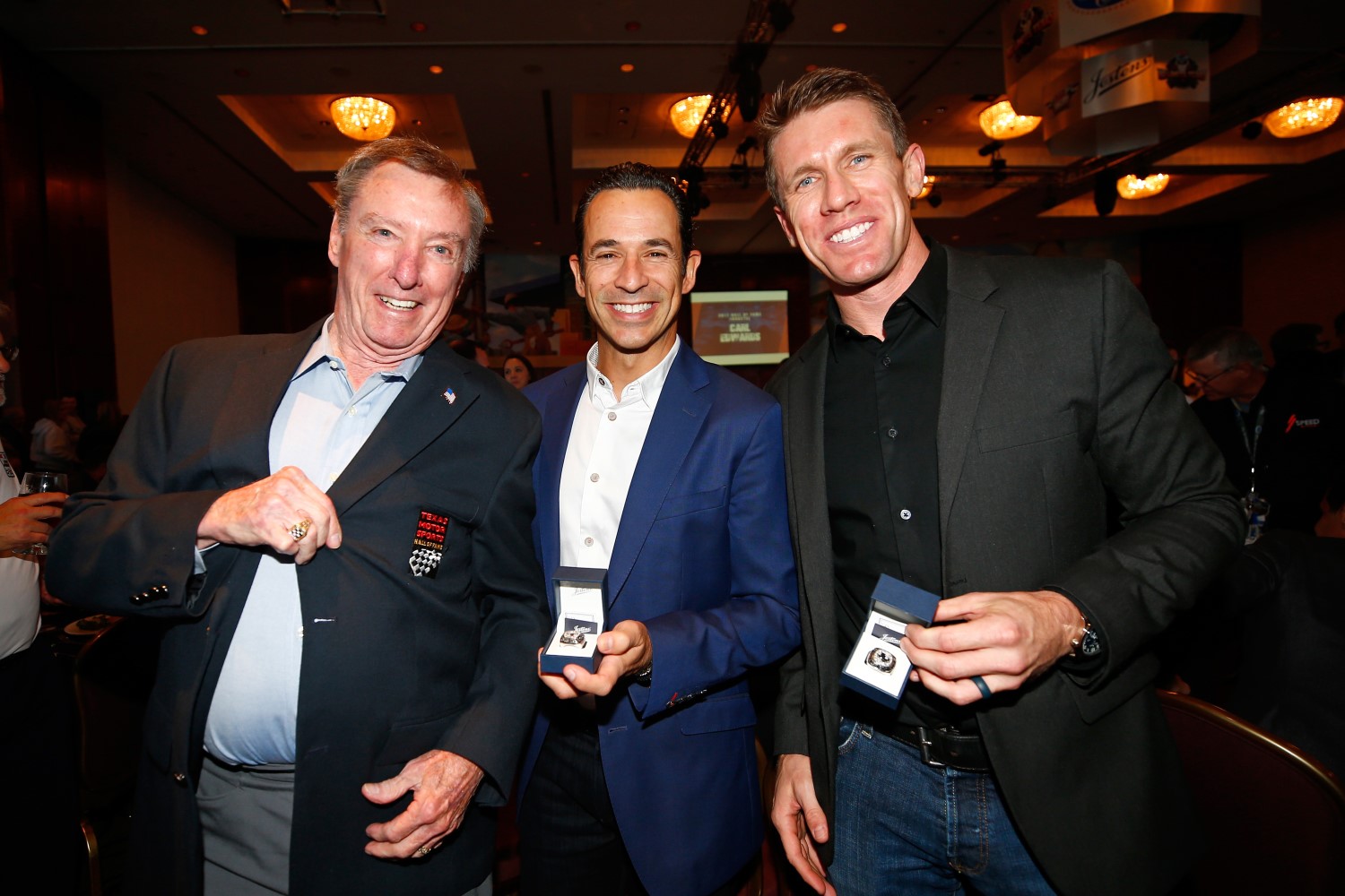 Johnny Rutherford, Helio Castroneves and Carl Edwards pose for a photo during the Texas Motorsports Hall of Fame ceremony