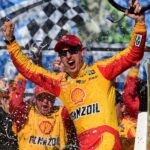 Joey Logano celebrates in victory lane after winning Sunday's Monster Energy NASCAR Cup Series race at Talladega Superspeedway