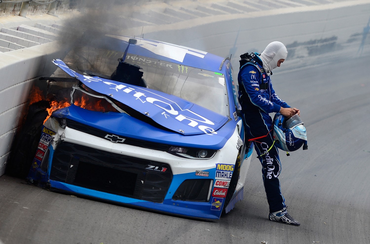 Kyle Larson, driver of the #42 Credit One Bank Chevrolet, stands on the track after being involved in an on-track incident during the Monster Energy NASCAR Cup Series O'Reilly Auto Parts 500 at Texas Motor Speedway