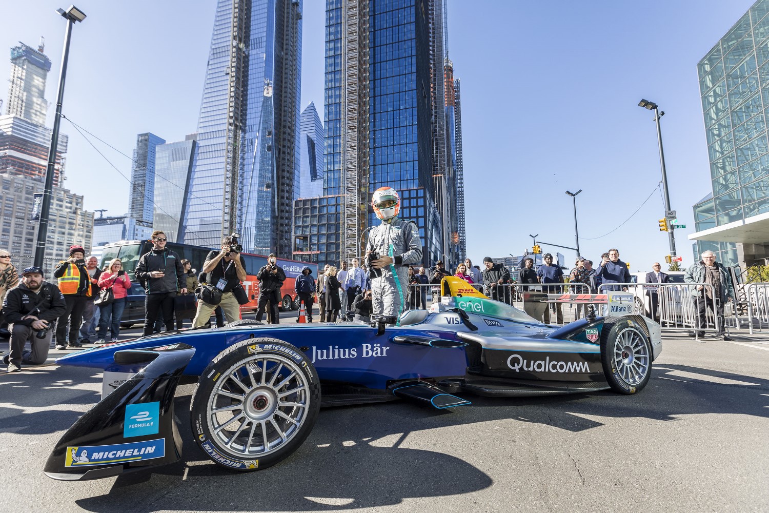 Nelson Piquet Jr. exiting the fully-electric Formula E car on 11th Ave. in Manhattan in front of some reporters