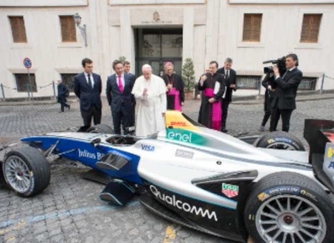 His Holiness Pope Francis Blessing The Fully-Electric Formula E Car Standing Alongside Alejandro Agag And Alberto Longo.