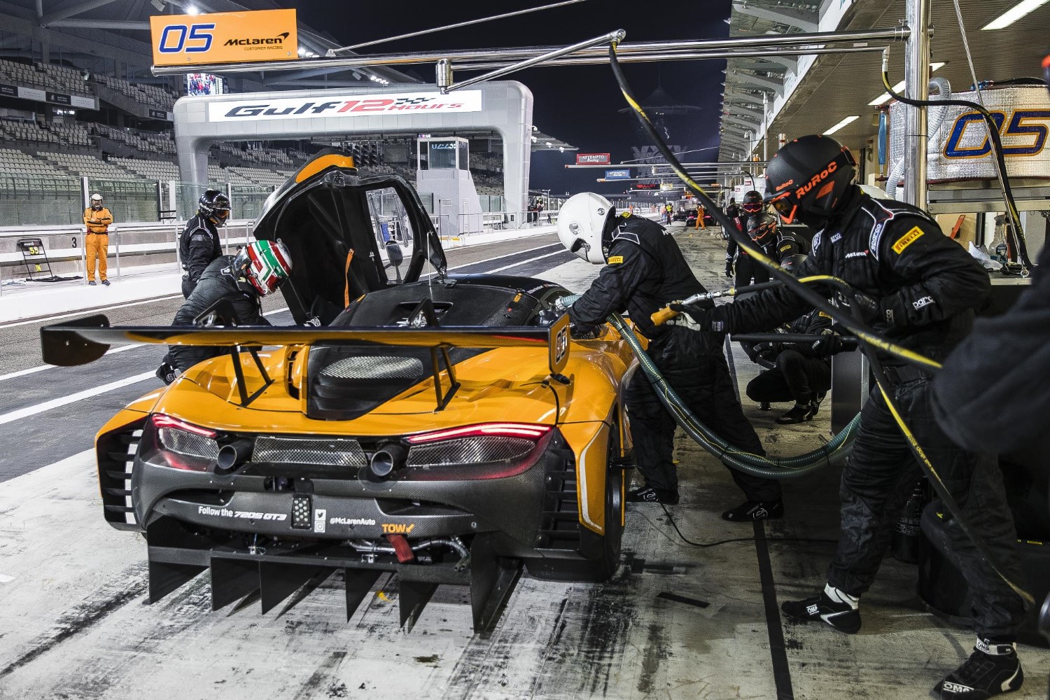 McLaren 720S GT3 comes in for pitstop. Note the packed grandstands